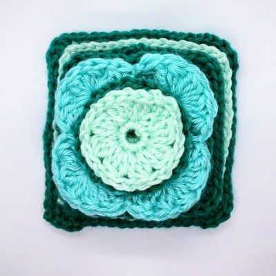 Ice flower granny square - free crochet pattern by Crochet Cloudberry. This pattern uses simple stitches to create raised petals and leaves.